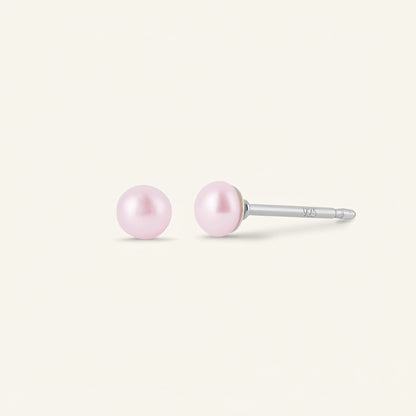 Pair of pink pearl earrings on a white background