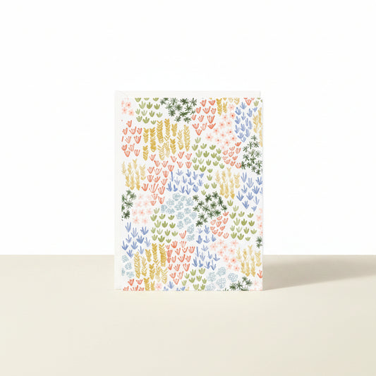 Colorful patterned paper with a geometric design on a white background